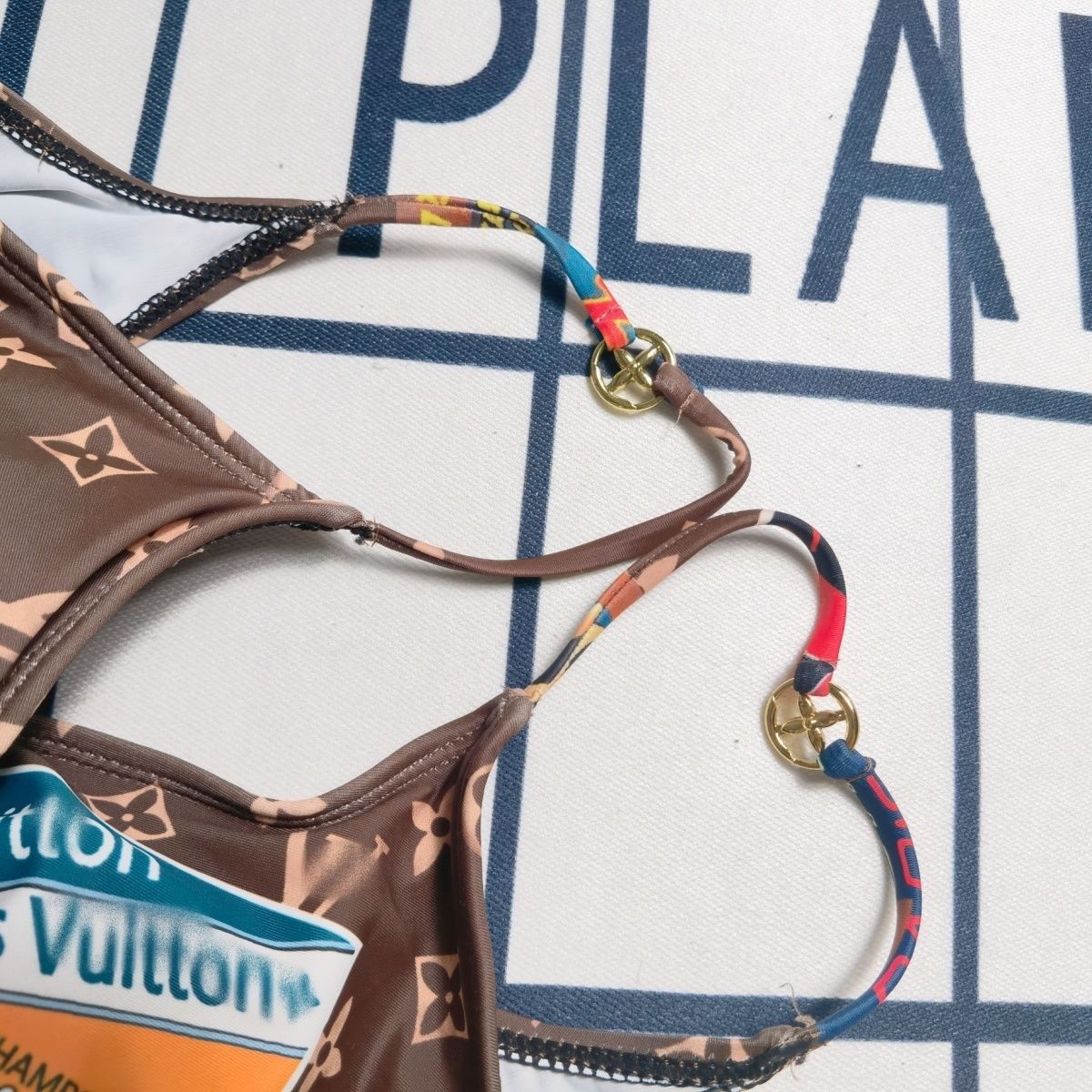 LV ONE-PIECE SWIMSUIT FEATURING VARIOUS PATCHES