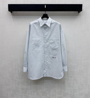 CHANEL STRIPED EMBROIDERED LOGO SHIRT WITH VERTICAL STRIPES